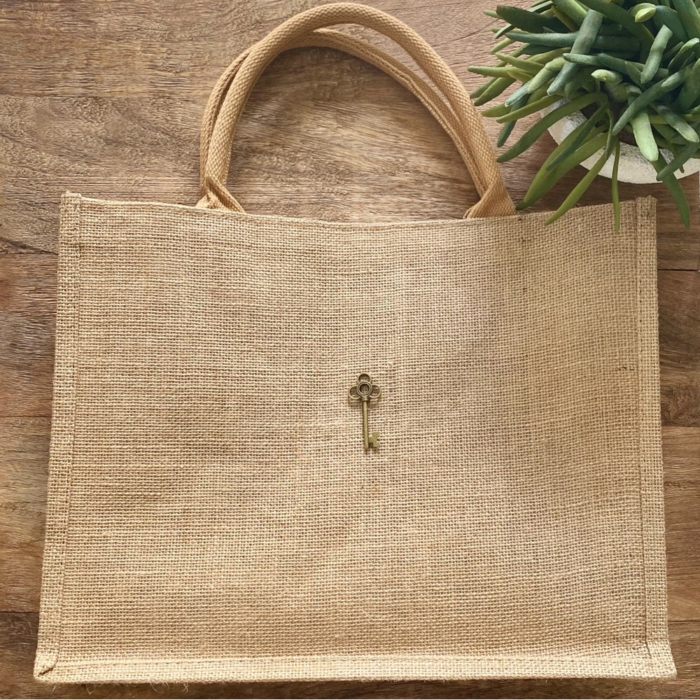 Elegant Tan Tote Bag with Key Charm Detail